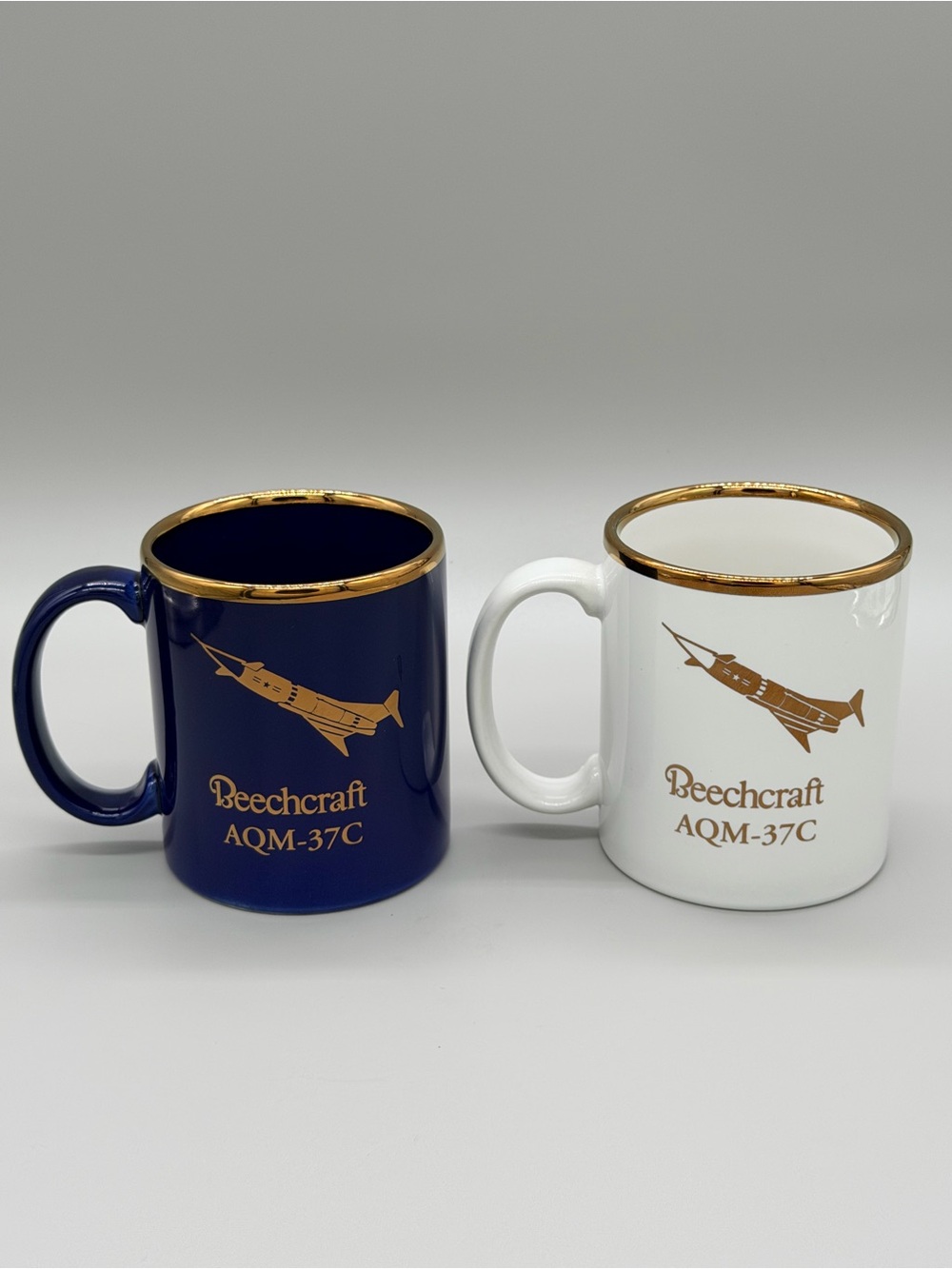 Vintage Beechcraft AQM-37C Jayhawk Target Drone Mug Pair Gold Rim Navy White USA